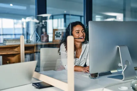 Women with headset_GettyImages-1299792196.png