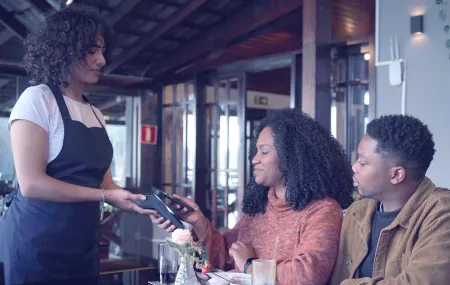 SMB_Payment at table_Couple_Contactless with smartphone_DX8000.png