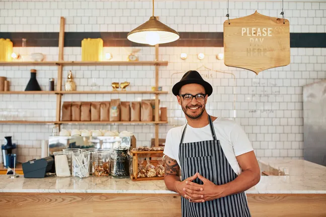 Coffee shop counter with smiling merchant copie.png